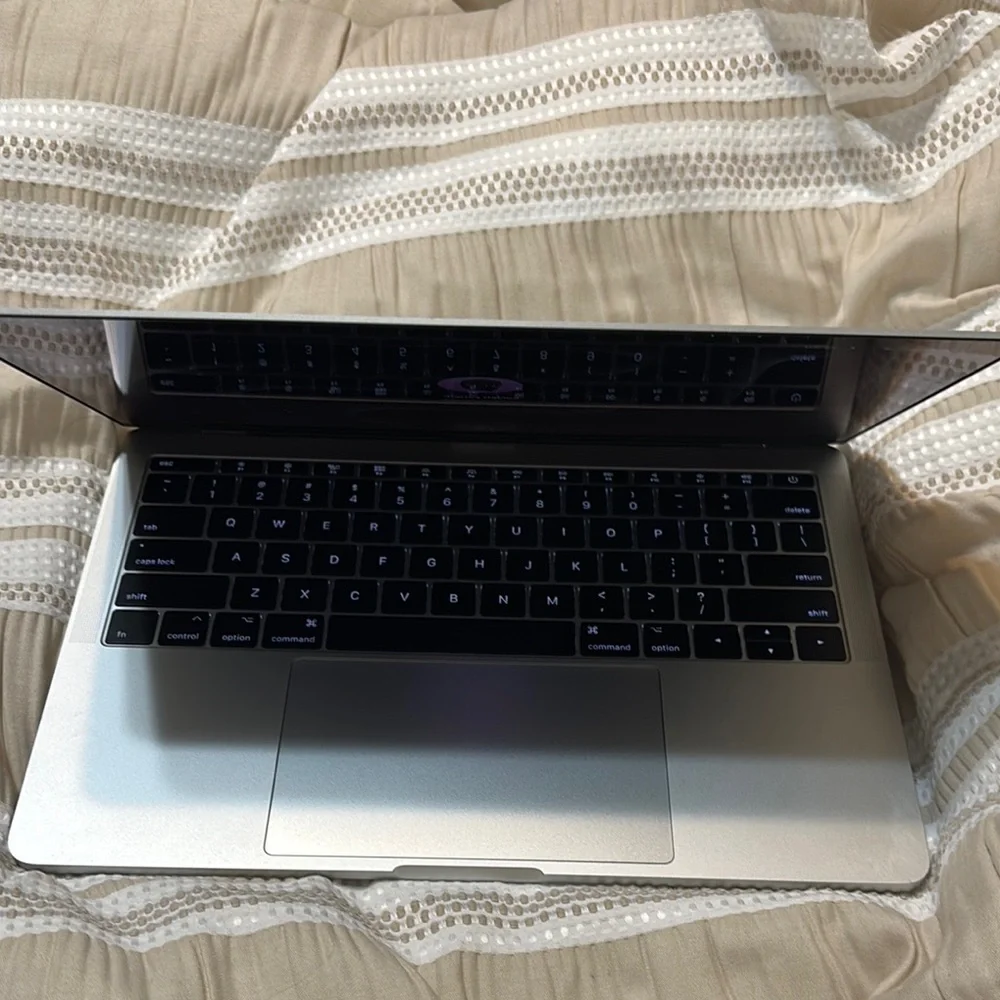 Apple Silver MacBook Pro with Backlit Keyboard and Touchpad